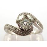 A diamond dress ring, the cluster composed of small marquise and princess cut stones, to pave set