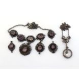 Two late 19th century/early 20th century white metal mounted necklaces, including a paste and