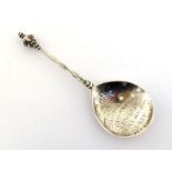 A Scandinavian silver spoon with cherub mask terminal, apparently unmarked except for a later French