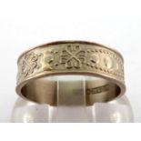 A white metal (tests 18 carat gold) ring, marked SPN 18K L11, 3.7 gms