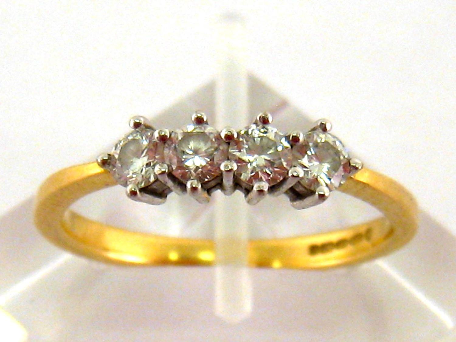 An 18 carat yellow gold and diamond ring, the four uniform brilliants totalling approx. 0.5carat,