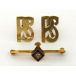 A pair of yellow metal (tests 14 carat gold) cuff links, the links cut as open work monogram 'RS',