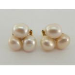 A pair of French cultured pearl and diamond ear studs, the trefoil of baroque pearls with a small