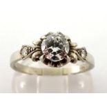 A single stone diamond ring, the central brilliant approx. 0.68 carat, claw set within a coronet