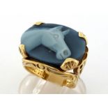 A glass cameo signet ring, the oval cameo depicting the head of a horse, 20 x 14.8mm, to