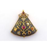 An Indian multi gem pendant, the triangular hardstone body inlaid with gold floral motifs, in turn