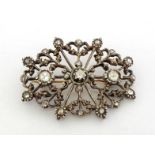 A rose cut diamond brooch, the oval open cut design set overall with rose cuts, the three