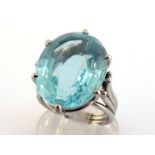 An aquamarine dress ring, the large oval mixed cut stone approx. 16.7 carats, to an 18 carat white