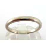 A platinum wedding band, finger size O, 5gms