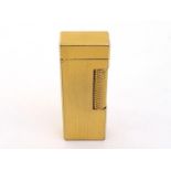 Dunhill, a gilt metal lighter, with rectangular engine turned body, 6.4cm long