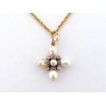 A Victorian freshwater pearl and diamond cross pendant, the quatrefoil of pearls with a bouton pearl