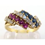 A sapphire, diamond and ruby 'tricolore' ring, composed of five graduating bands of alternate