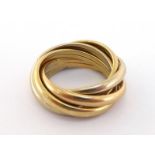 An 18 carat gold Russian wedding ring, composed of five bands of white, rose and yellow gold,