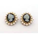 A pair of Victorian sardonyx cameo and seed pearl brooches, each small oval cameo depicting a