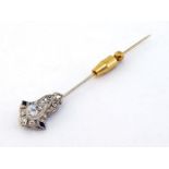 An early 20th century diamond and sapphire stick pin, the openwork design milligrain set with