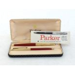 PARKER 61 Custom, a fountain pen and pencil set, the fountain pen with capillary filler, red