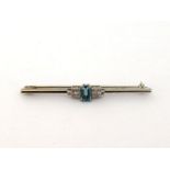 An Art Deco aquamarine and diamond bar brooch, the central rectangular cut aquamarine 7.5 x 4.2mm,