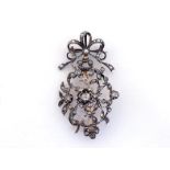 A mid 19th century Dutch diamond and seed pearl brooch/pendant, the openwork design of bud amonst