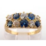 An early 20th century 18 carat gold, sapphire and diamond ring, composed of two rows of