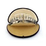 An early 20th century paste set tiara, composed of thirteen graduated white brilliant set points,