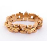 A French 18 carat gold bracelet, composed of domed and triangular links, to concealed snap clasp,