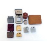 A mixed lot of lighters, including a gilt metal Colibri with watch insert, a Colibri black lacquer