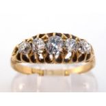 An 18 carat gold and diamond five stone ring, set with five graduated mine cuts, the largest stone