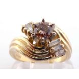 A fancy coloured (untested) cognac diamond dress ring, the central brilliant approx. 0.35 carat,