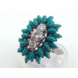 A diamond and turquoise cluster ring, set to the centre with three graduated brilliants totalling