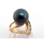 A Tahitian cultured pearl and diamond dress ring, the black spherical pearl 12.3mm, to three channel