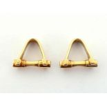 Cartier, a pair of 18 carat gold cufflinks, of stirrup form, signed and numbered 259023, each18mm