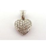 A diamond heart pendant, pave set overall with small brilliants, mounted in white metal (tests 18