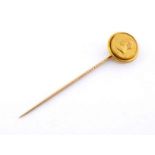 Royal interest, a gift from Queen Victoria:- a Victorian gold memento mori stick pin depicting