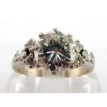 A diamond dress ring, the brilliant cut approx. 1.39 carat, a trefoil of brilliants and marquise cut