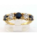 A diamond and sapphire five stone ring, set with alternate brilliants and round cut sapphires,