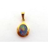 An opal composite pendant, set to the centre with an oval opal triplet, in a broad border, the