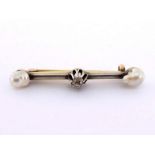 A diamond and fresh water pearl bar brooch, set to the centre with a small old cut stone, with pearl