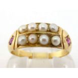 A late Victorian 18 carat gold split pearl and ruby ring, set to the centre with two rows of 2.