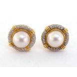 A pair of diamond and mabe pearl earrings, the central pearl 13mm diameter, in a surround of pave