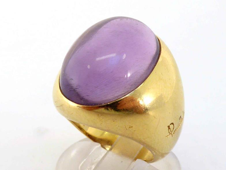 Pomellato 67, an 18 carat gold and amethyst dress ring, the large oval cabochon 20 x 14mm, the heavy