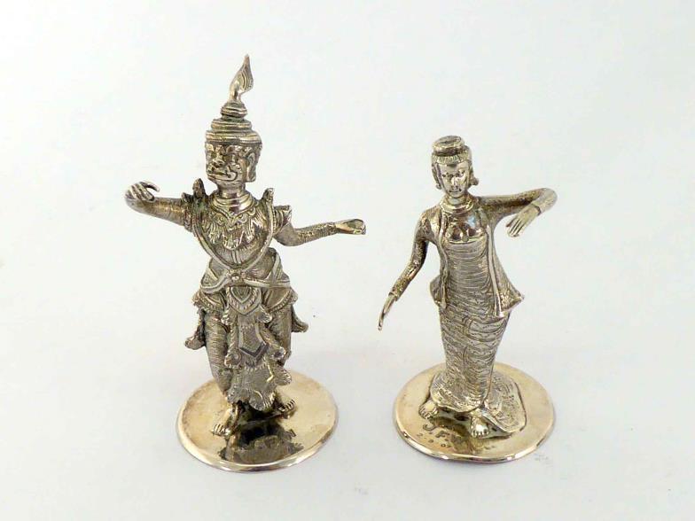 A pair of Burmese cast silver figural menu-holders, circa 1907, one modelled as a temple dancer