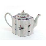 A New Hall ceramic "silver shape" teapot, circa 1790, with painted sprigs decorating the white body,