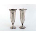 A pair of silver flower vases by Elkington & Co., Birmingham, 1914, with wavy rims and loaded