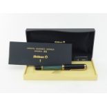 Pelikan, Souveran, a black and striated green marble resin fountain pen, with fine nib and piston