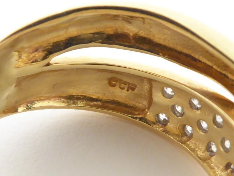 A diamond cross over ring, the lower band pave set with three rows of small brilliants, the shank - Image 5 of 10