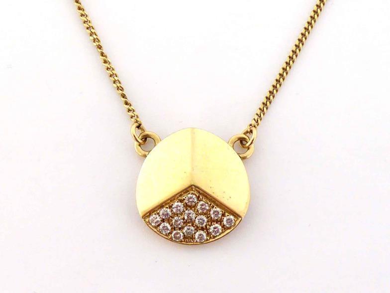 A diamond pendant by Bucherer, the circular body raising to a three faced pyramid, one face pave set