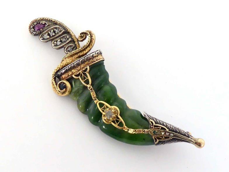 A nephrite, diamond, ruby and sapphire brooch, in the form of a khanjar, with carved nephrite