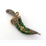 A nephrite, diamond, ruby and sapphire brooch, in the form of a khanjar, with carved nephrite