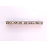 A diamond bar brooch, pave set along its length with uniform brilliants totalling approx. 0.90