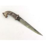 An Indian dagger with white metal (tests silver) handle chased with flowers and terminating in a